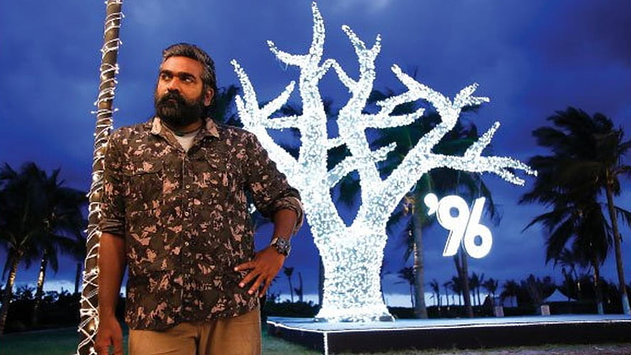 Vijay Sethupathi in 96 Movie Still with Illuminated Tree and Palm Trees at Dusk HD wallpaper