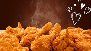 Crispy Golden Fried Chicken With Rising Steam And Hand-Drawn Hearts On Dark Background HD wallpaper