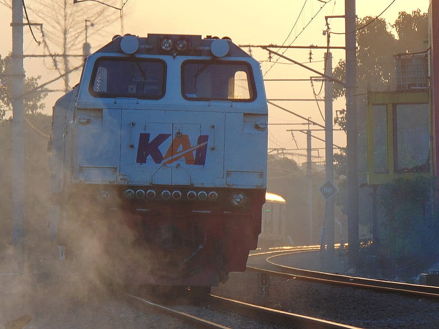 KAI Electric Locomotive on Curved Track at Golden Hour in Indonesia HD wallpaper