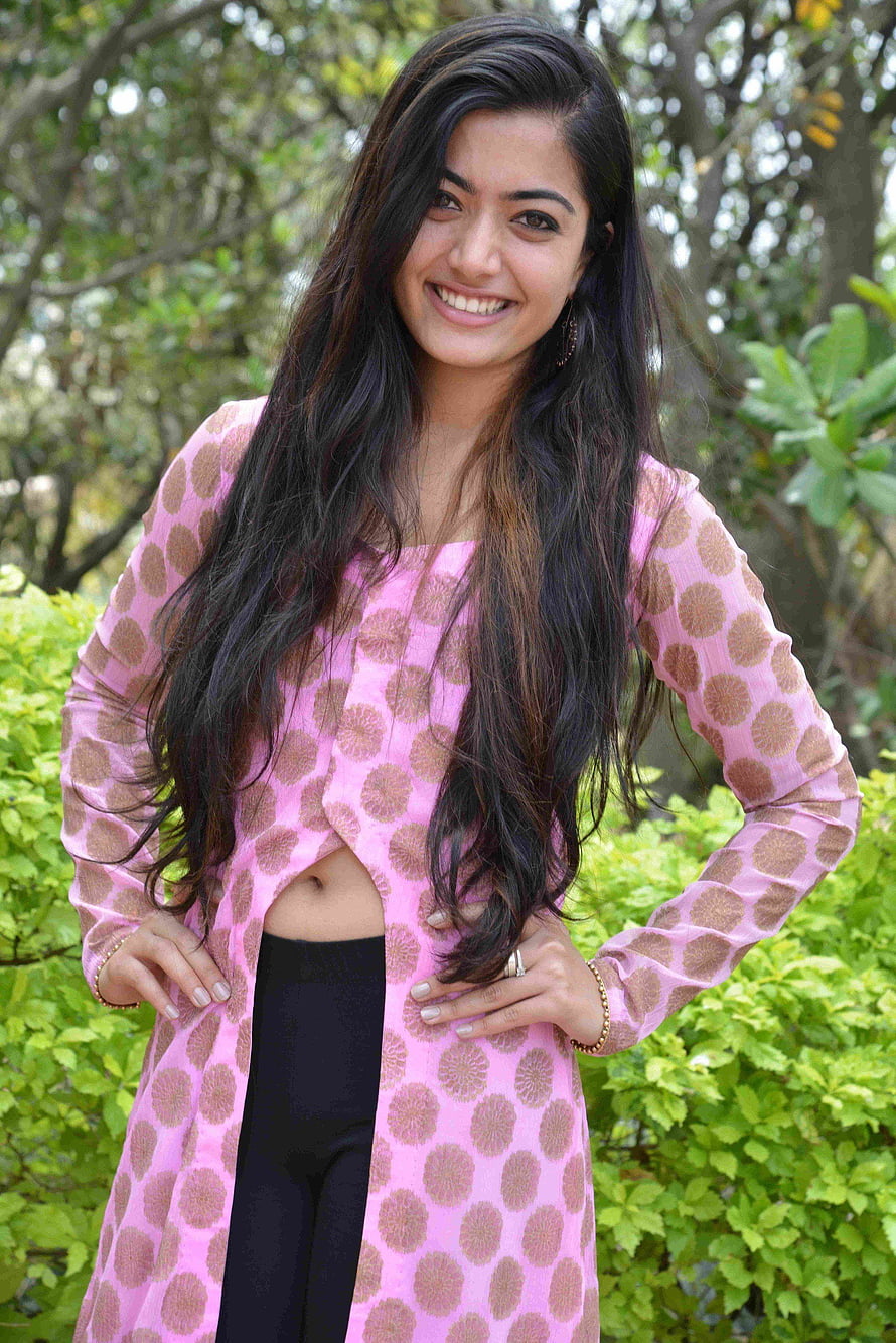 Rashmika Mandana in a pink patterned kurta with black leggings outdoors HD phone wallpaper