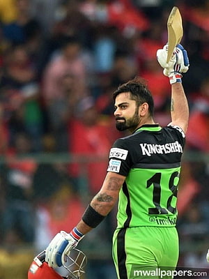 Virat Kohli in Kings XI Punjab Green Jersey Raising Bat in Celebration HD phone wallpaper