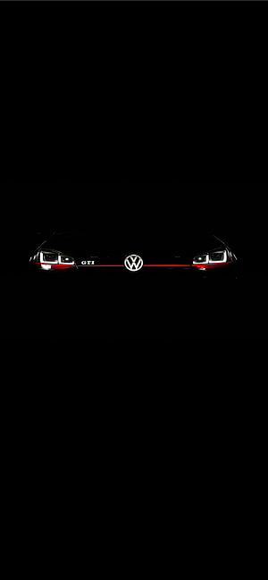 Volkswagen Golf GTI Front Grille with LED Headlights and Red Accent Line in Dark Setting HD phone wallpaper