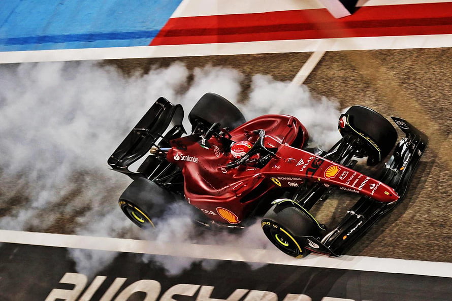 Charles Leclerc Ferrari F1 Car Drifting Through Tire Smoke on the Race Track HD wallpaper