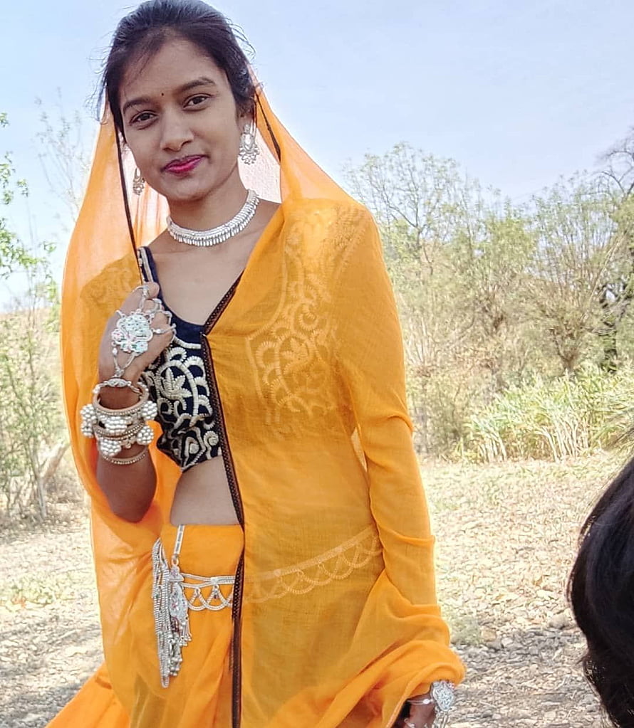 Young Woman in Traditional Orange Saree with Silver Jewelry and Embroidered Blouse HD phone wallpaper