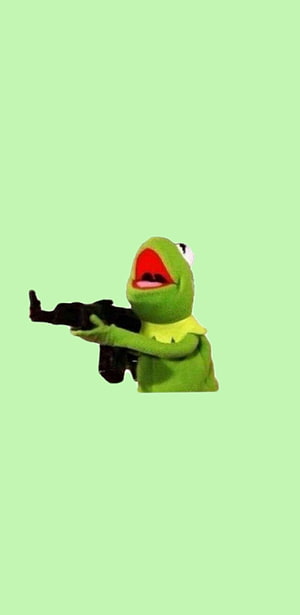 Kermit the Frog holding a rifle against a solid light green background HD phone wallpaper