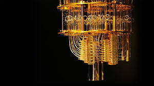 Intricate Golden Quantum Computer Hardware with Coils and Wires on Black Background HD wallpaper