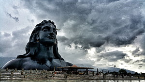 Adiyogi Shiva Statue Under Dramatic Stormy Sky HD wallpaper