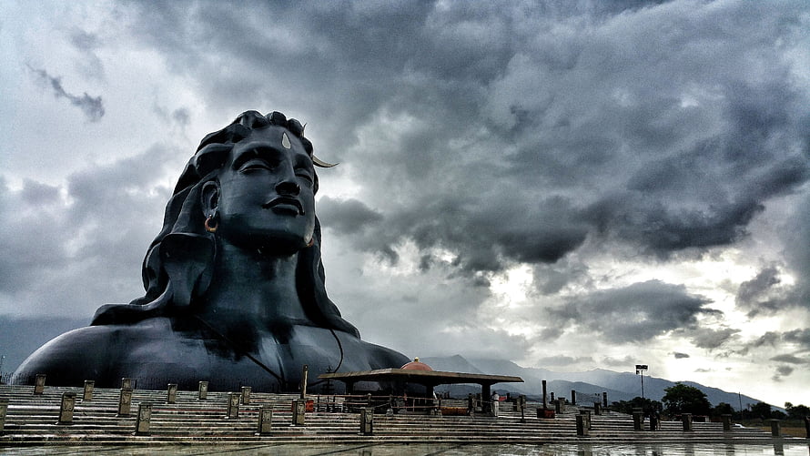 Adiyogi Shiva Statue Under Dramatic Stormy Sky HD wallpaper