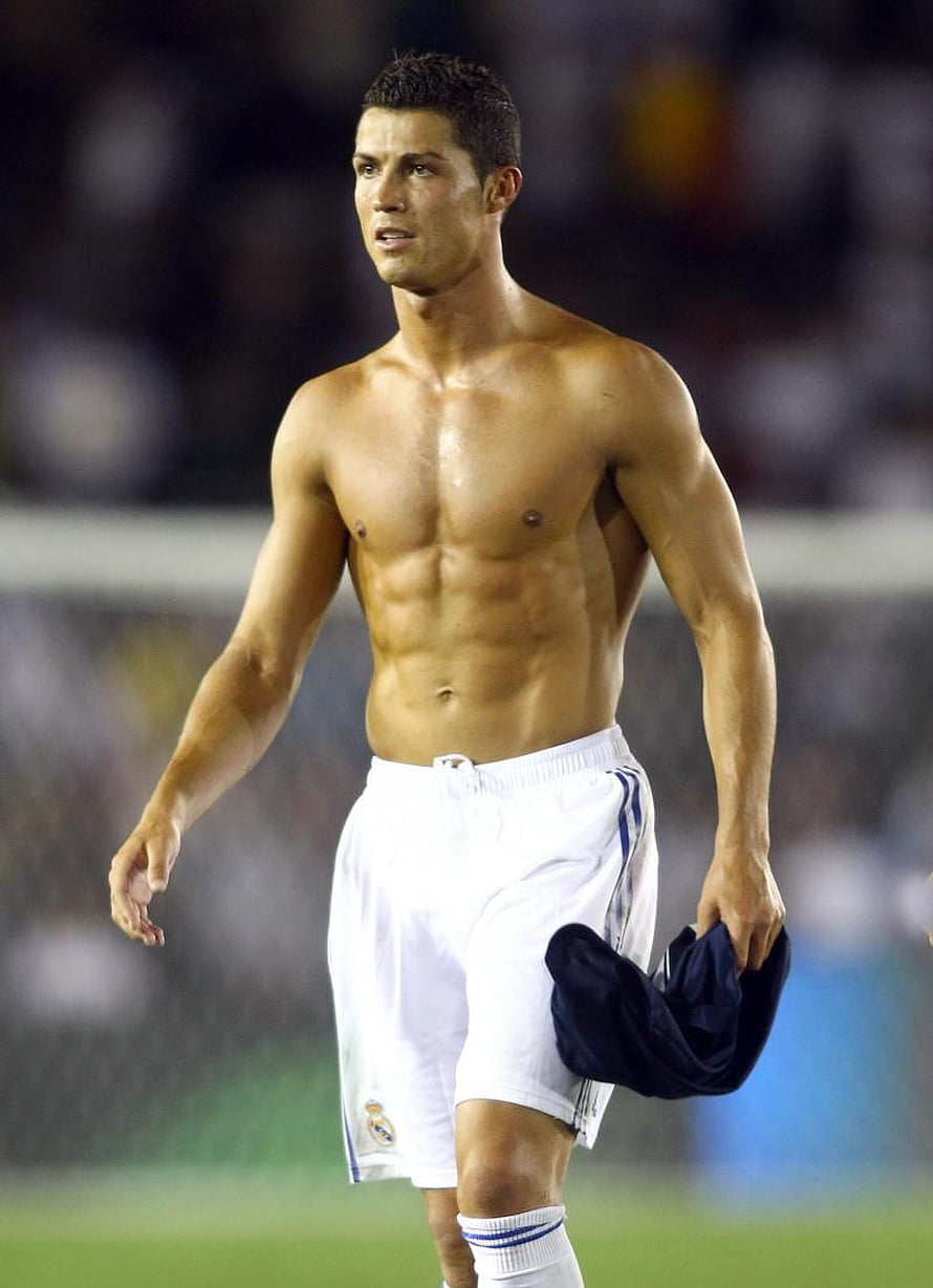Cristiano Ronaldo shirtless on the pitch wearing Real Madrid shorts HD phone wallpaper