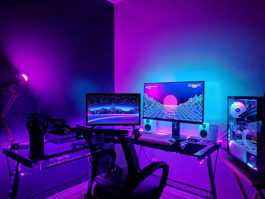 Neon Purple Gaming Room with Dual Monitors and RGB PC Build HD wallpaper