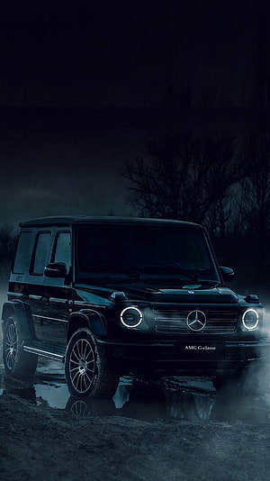 Mercedes-AMG G-Class SUV in Dark Night Setting with Glowing Headlights HD phone wallpaper
