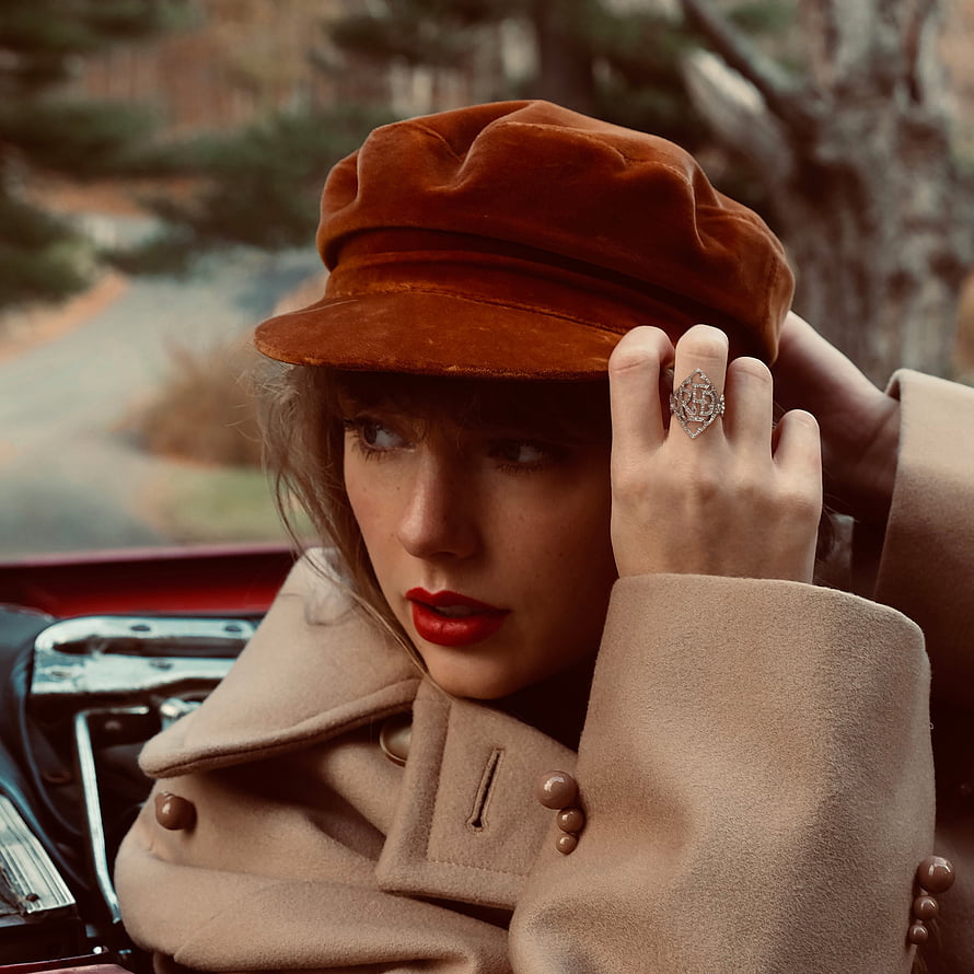 Taylor Swift in Rust Velvet Cap and Beige Coat Leaning on Vintage Car HD phone wallpaper