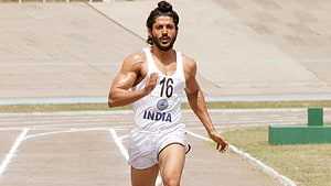 Milkha Singh Running on Track in White India Athletics Uniform HD wallpaper