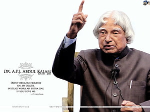 Dr. A.P.J. Abdul Kalam Pointing Upward in Formal Bandhgala Suit with Inspirational Quote HD wallpaper