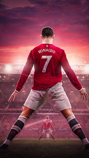 Cristiano Ronaldo in Manchester United Kit Standing on the Pitch at Sunset HD phone wallpaper