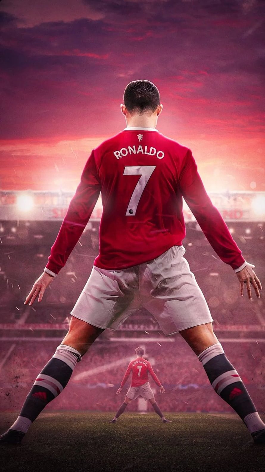 Cristiano Ronaldo in Manchester United Kit Standing on the Pitch at Sunset HD phone wallpaper