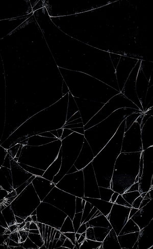 Shattered Black Glass Surface with Intricate Web of Cracks and Fracture Lines HD phone wallpaper