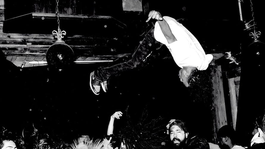 Playboi Carti Performing an Aerial Dive Over a Live Concert Crowd HD wallpaper