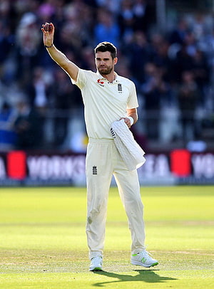 James Anderson in England Test Kit Holding Ball and Sweater on the Cricket Field HD phone wallpaper