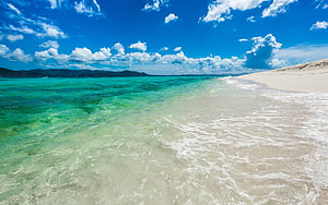Turquoise Shallow Waters Lapping Against White Sand Beach Under Blue Sky HD wallpaper