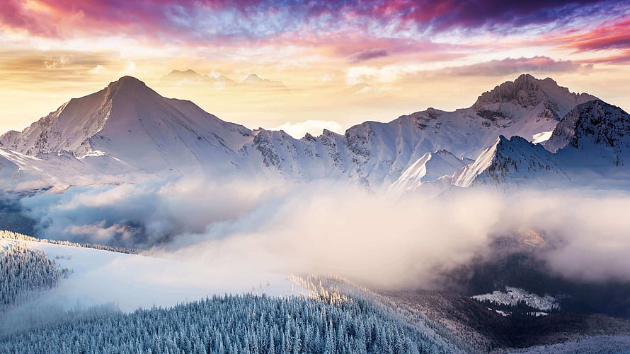 Snow-Capped Mountain Peaks Rising Above a Sea of Mist at Sunset HD wallpaper