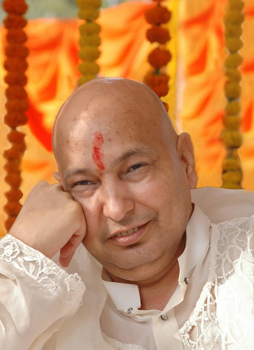 Portrait of a bald spiritual leader with a red tilak on his forehead wearing a white embroidered shirt HD phone wallpaper