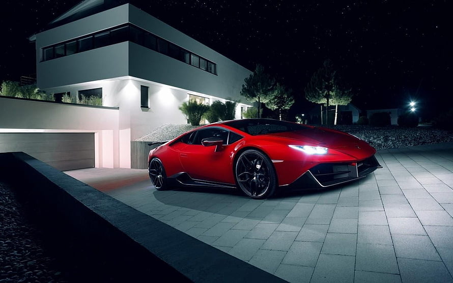 Red Lamborghini Huracan Stopped in Front of Modern Villa at Night HD wallpaper