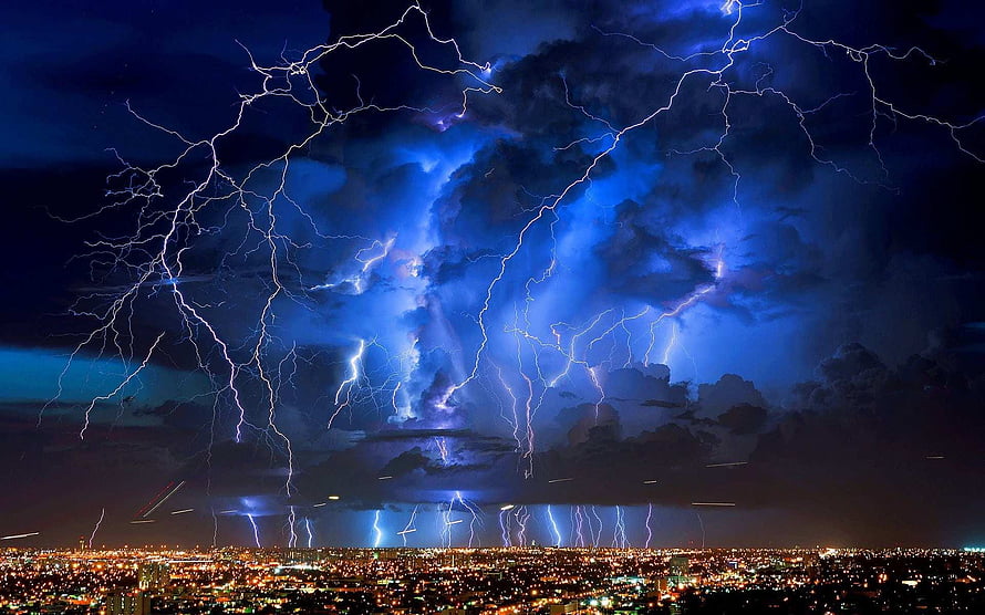 Dramatic Night Thunderstorm with Multiple Lightning Strikes Over a City Skyline HD wallpaper