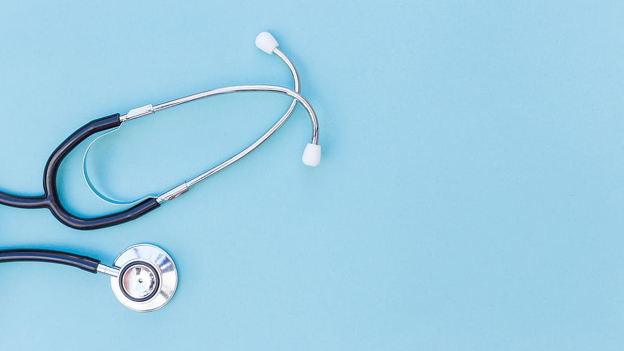 Minimalist Medical Stethoscope on Light Blue Background for Healthcare Presentation HD wallpaper