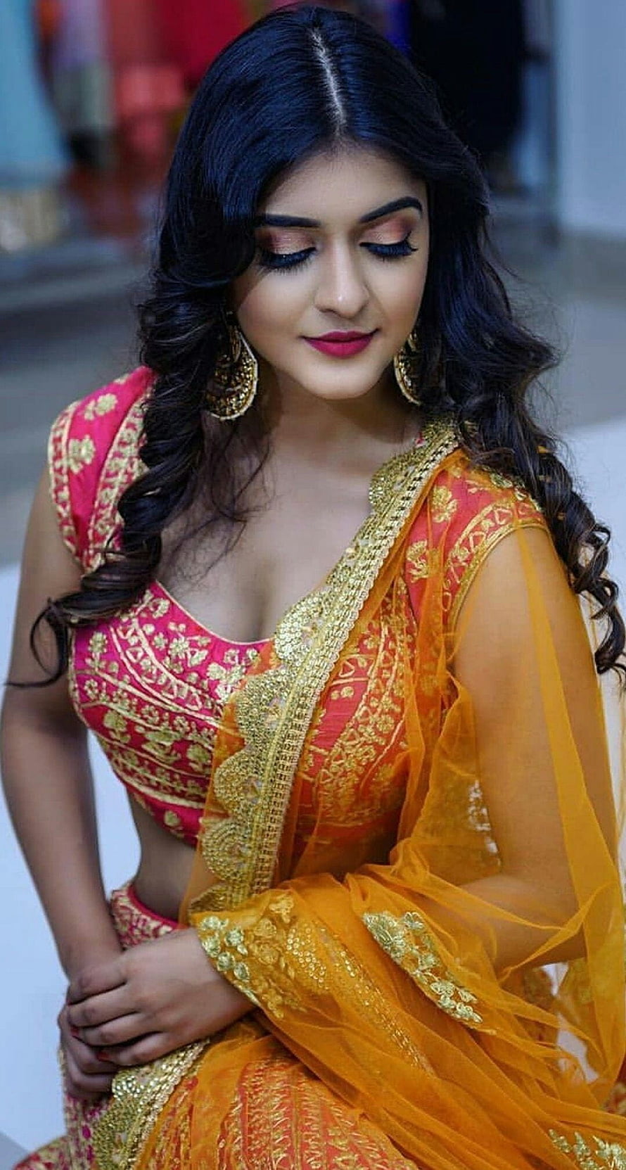 Elegant Indian Woman in Vibrant Pink and Gold Embroidered Lehenga with Orange Dupatta HD phone wallpaper