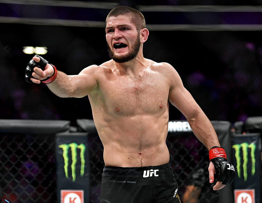Khabib Nurmagomedov Celebrating Victory in the UFC Octagon HD wallpaper