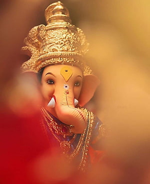 Ganesha Portrait with Golden Crown and Red Garland in Warm Bokeh Light HD phone wallpaper