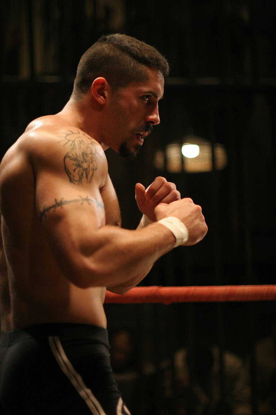 Yuri Boyka in a Focused Boxing Stance Inside a Dark Ring HD phone wallpaper