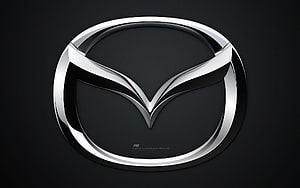 Mazda Emblem in Polished Chrome on a Dark Background HD wallpaper