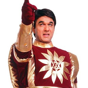 Shaktiman Hero in Red and Gold Costume with Pointing Finger HD phone wallpaper