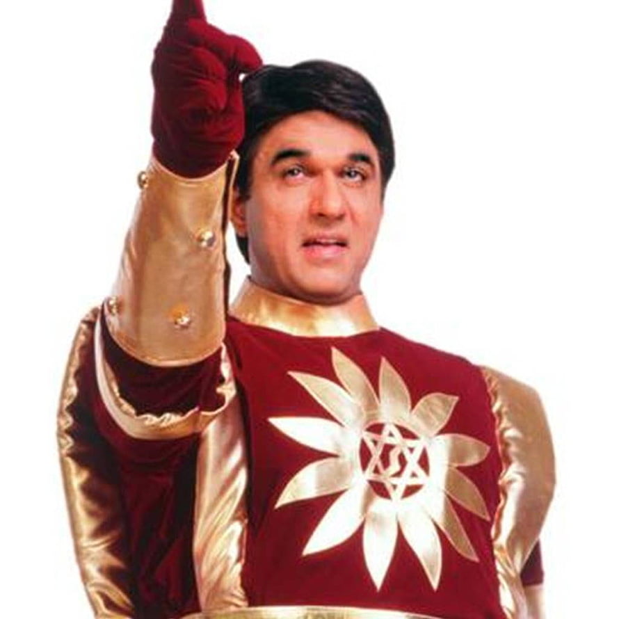 Shaktiman Hero in Red and Gold Costume with Pointing Finger HD phone wallpaper