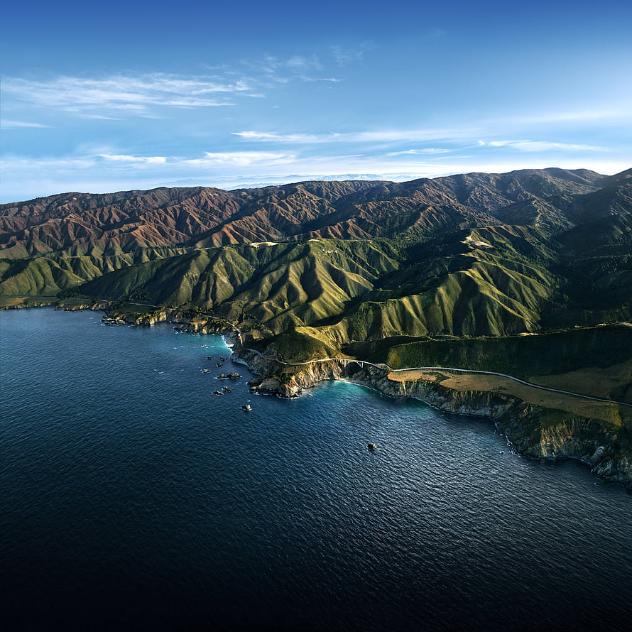 Aerial View of Dramatic Coastal Cliffs and Rolling Green Hills Meeting Deep Blue Ocean Water HD phone wallpaper