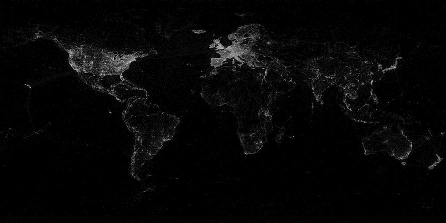 Illuminated World Map at Night with City Lights on Black Background HD wallpaper