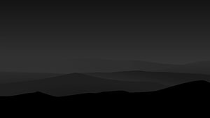 Dark Minimalist Mountain Silhouettes Against a Moody Night Sky HD wallpaper