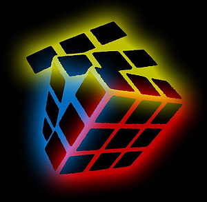 Neon Glowing Rubik's Cube with Vibrant Rainbow Light Trails on Black Background HD wallpaper