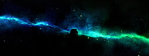 Vibrant Blue and Green Nebula with Dark Dust Silhouette in Deep Space HD wallpaper