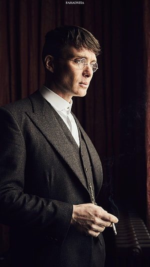 Thomas Shelby in a vintage three-piece suit holding a cigarette with round glasses HD phone wallpaper