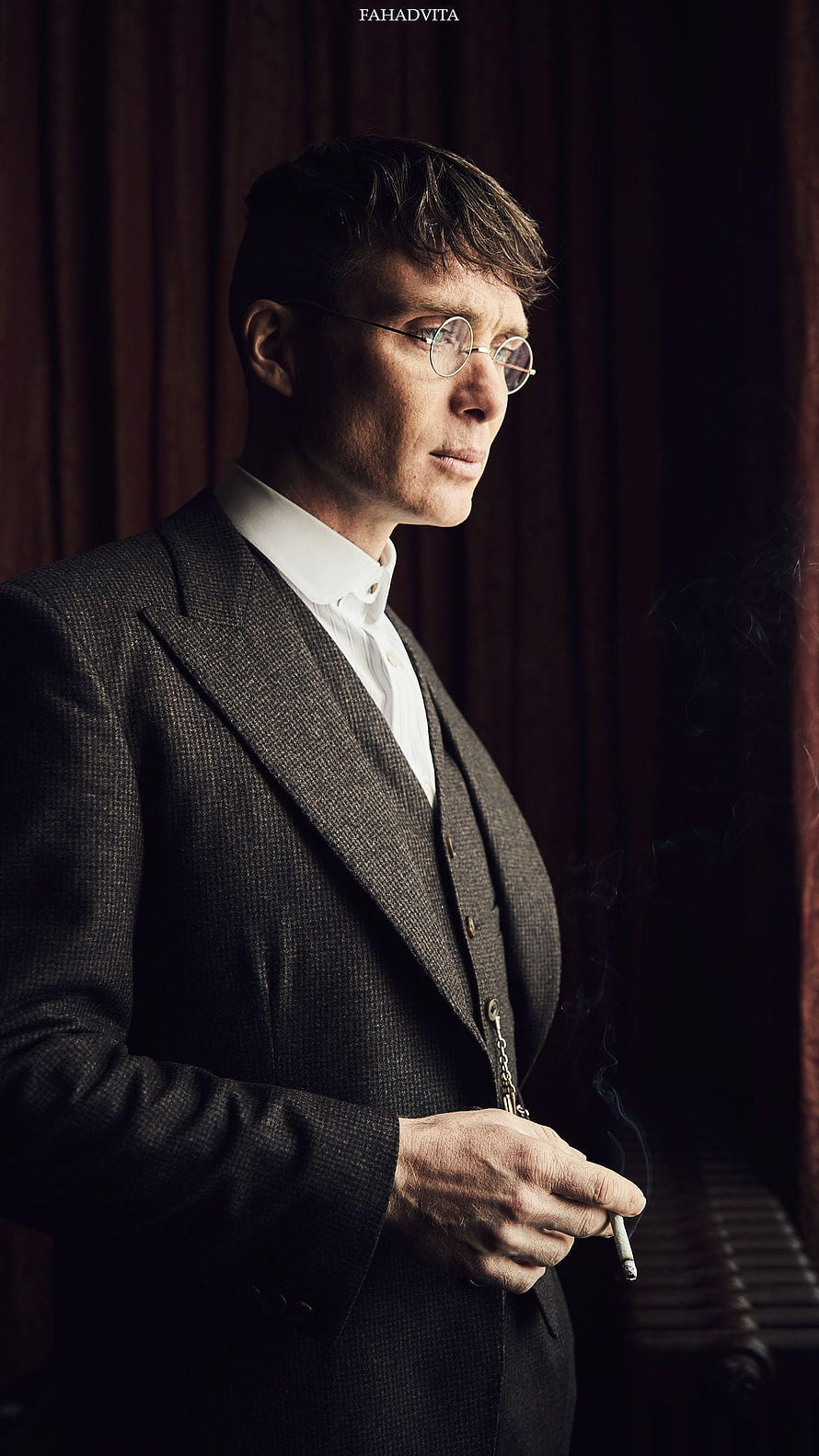 Thomas Shelby in a vintage three-piece suit holding a cigarette with round glasses HD phone wallpaper