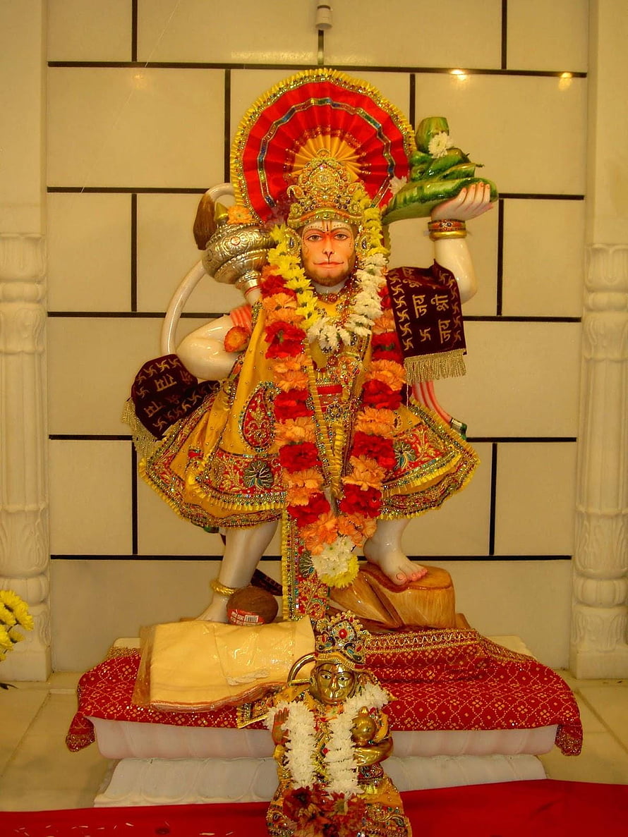 Ornate Hanuman Murti Adorned With Marigold Garlands And Sacred Offerings In Temple Setting, Hanuman Ji Source, hanuman ji full mobile HD phone wallpaper