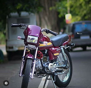 Customized Hero Splendor Motorcycle in Deep Maroon with Chrome Accents and Black Seat HD wallpaper