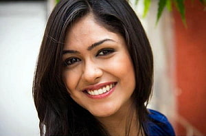 Mrunal Thakur Smiling Portrait with Dark Hair and Blue Top HD wallpaper
