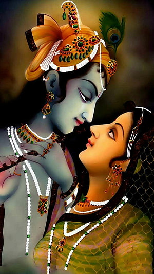 Krishna and Radha in Intimate Embrace with Traditional Indian Jewelry and Peacock Feather Crown HD phone wallpaper