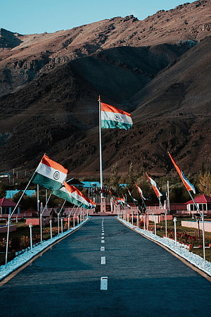 Indian National Flags Lining a Mountain Road in Dras, Himalaya HD phone wallpaper