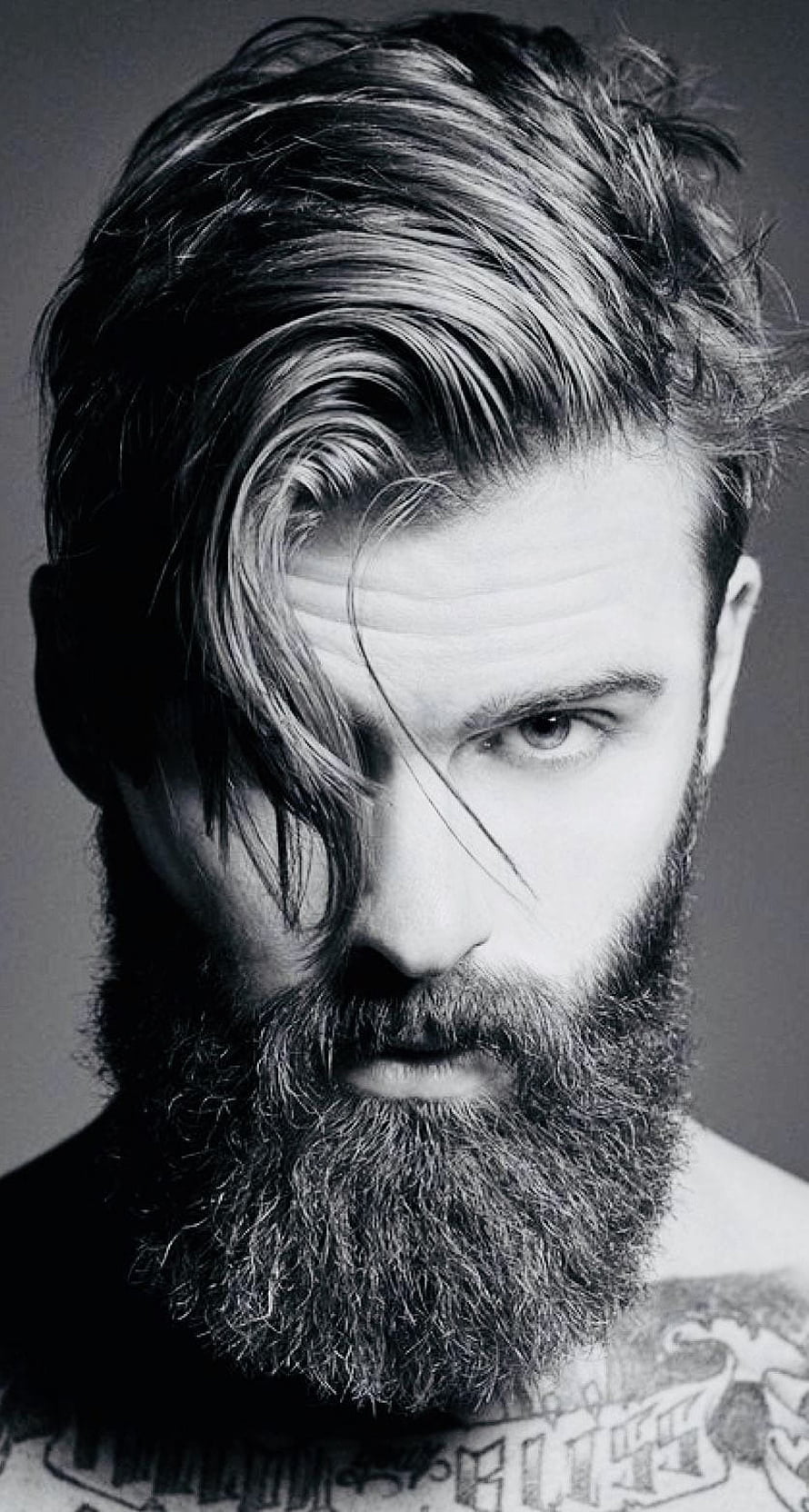 Black and White Portrait of a Bearded Man with Long Swept Hair and Chest Tattoos HD phone wallpaper