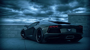 Black Lamborghini Aventador Rear View Under Dramatic Stormy Sky HD wallpaper